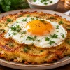 Обычные драники уже надоели? Картофельный блин с яйцом внутри получается с хрустящей корочкой и превращает три простых продукта в сытный завтрак